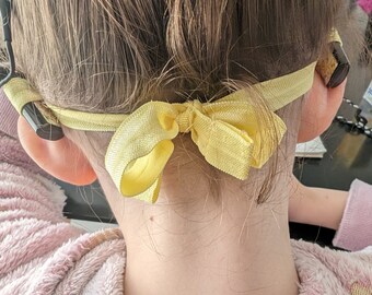 Tie-on headband for cochlear implants and hearing aids