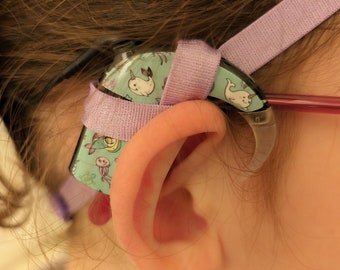 Non-slip headband for holding implants and hearing aids for girls