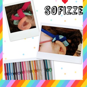 Può includere: Una varietà di cinturini colorati per apparecchi acustici, con il nome del marchio "SOFIZZE" in testo bianco su sfondo bianco. I cinturini sono realizzati in tessuto e presentano una varietà di motivi, tra cui pois, strisce e stampe floreali.