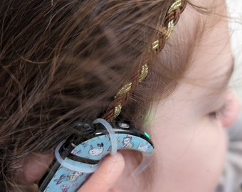 Braided headband for holding implants and hearing aids