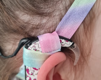 Adjustable headband for cochlear implants and hearing aids