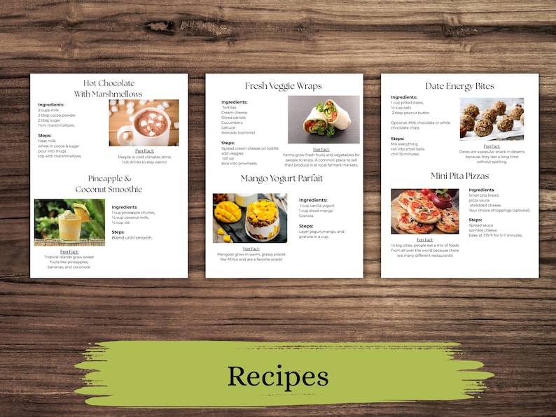 以下が含まれることがあります： 木製の表面に3枚のレシピカード。レシピには、マシュマロ入りホットチョコレート、フレッシュベジラップ、デーツエナジーバイトが含まれています。画像には、パイナップルとココナッツのスムージー、マンゴーヨーグルトパフェ、ミニピザのレシピも表示されています。