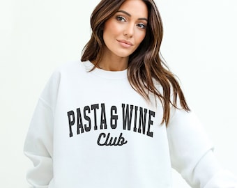 May include: White crewneck sweatshirt with the text "PASTA & WINE Club" in black.