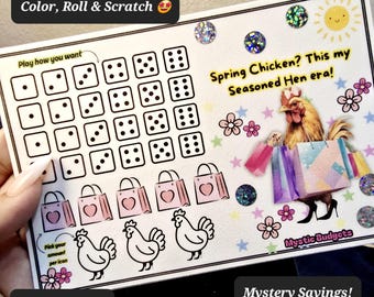 May include: A white card with a dice game layout, shopping bags, and chicken illustrations. The card features the text "Color, Roll & Scratch," "Spring Chicken? This my Seasoned Hen era!" and "Mystery Savings!" with the text "Scratch #s 2-4".