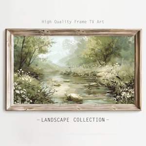 May include: A framed painting of a forest scene with a river flowing through it. The painting is in a rustic wooden frame and has a soft, muted color palette. The text "High Quality Frame TV Art" and "Landscape Collection" is visible below the painting.
