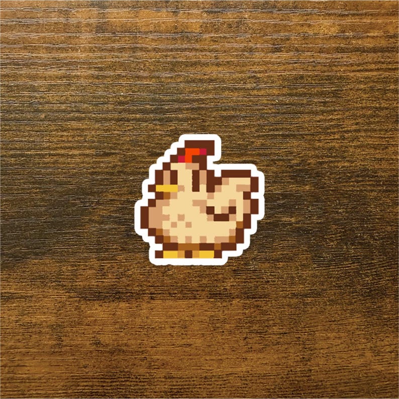 May include: A pixelated illustration of a brown chicken with a red comb and yellow beak. The chicken is facing the right side of the image.