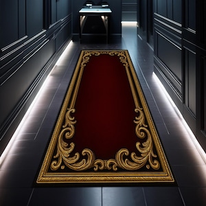 May include: A rectangular red hallway rug with a gold ornate border and detailing. The rug is placed on a dark tiled floor in a hallway with dark walls and trim. The rug's design is symmetrical and classic.
