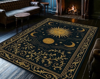 May include: A rectangular area rug with a celestial design. The rug features a dark blue background with gold sun, moon, and star illustrations. The border has an ornate gold floral pattern. The rug is placed on a dark wood floor.