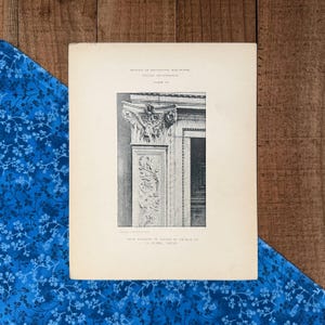 May include: A black and white print of a decorative sculpture from the Italian Renaissance. The print shows architectural details, including a column with ornate carvings and the text "DETAILS OF DECORATIVE SCULPTURE, ITALIAN RENAISSANCE."