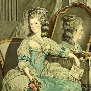 May include: A woman in a blue and white dress sits in a chair, looking at her reflection in a mirror. She holds a bouquet of pink roses in her hand. The mirror is decorated with a gold frame and a red curtain.