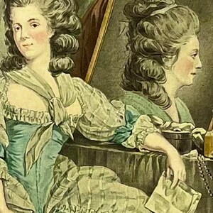 May include: A painting of two women in 18th-century dress. The woman on the left is wearing a light blue dress with a white lace collar and a white bow at the neck. The woman on the right is reflected in a mirror, wearing a similar dress with a white lace collar and a white bow at the neck.