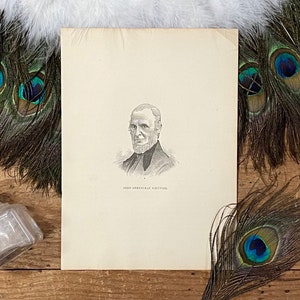 May include: Black and white portrait of a man with a beard and mustache. The man is wearing a dark suit and a white shirt. The portrait is on a white paper with the text "JOHN GREENLEAF WHITTIER" printed below.