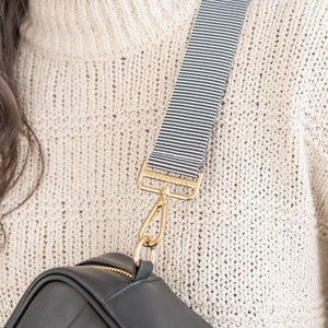 A black and white striped bag strap.