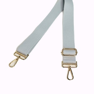 A soft gray and white striped strap.