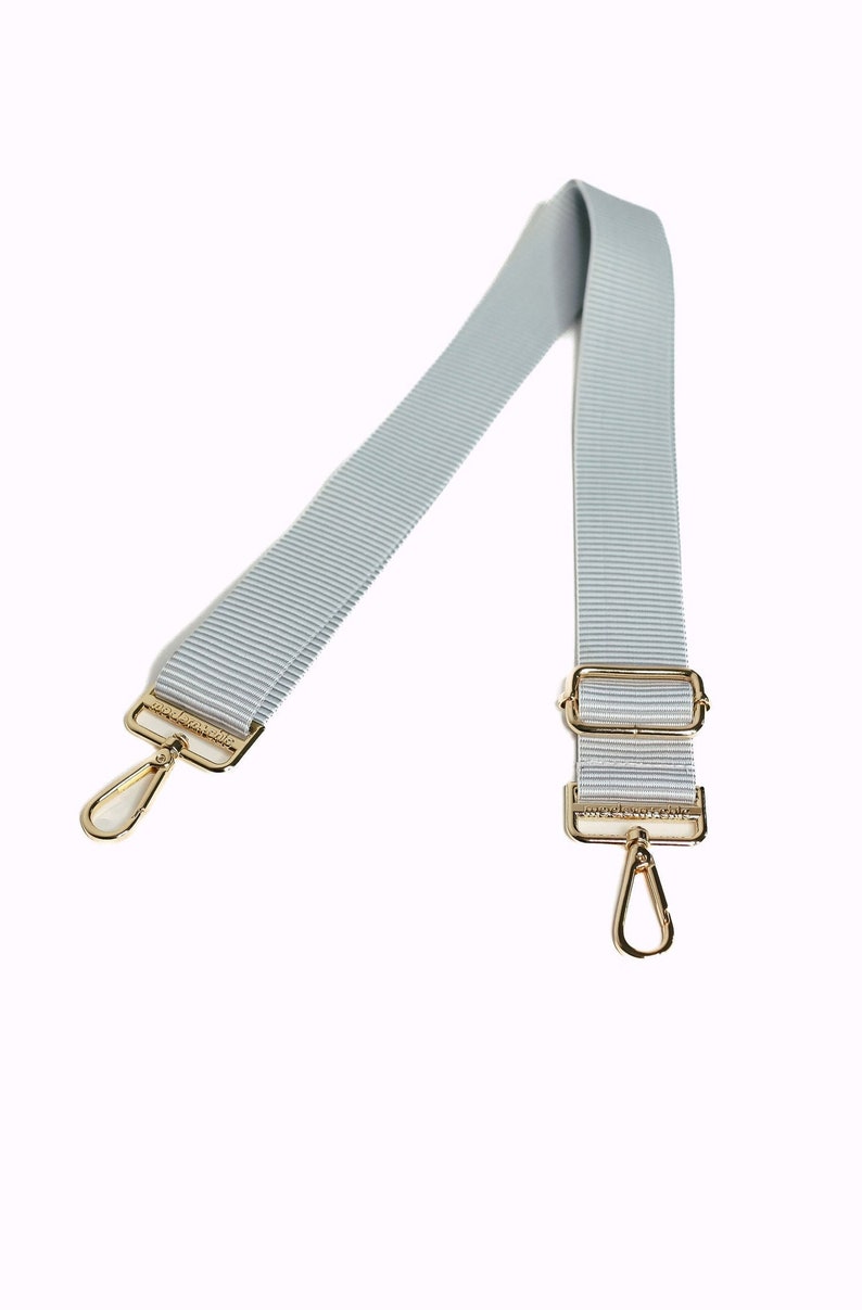 A soft gray and white striped strap.