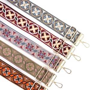 May include: Five colorful woven straps with gold metal clasps and hooks. The straps have a geometric pattern with various colors including red, blue, green, and brown.