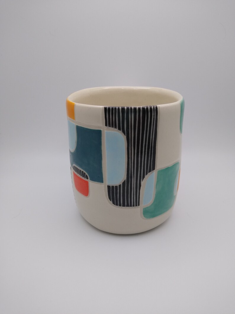 Handbuilt Porcelain Mug With Underglaze Painting and Sgraffito Carving