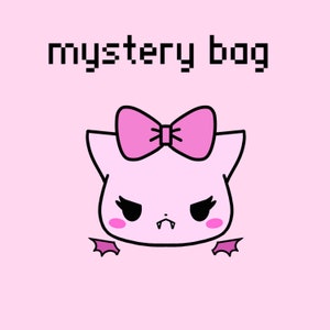 May include: A pink cartoon cat with a pink bow, fangs, and wings. The text "mystery bag" is above the cat.