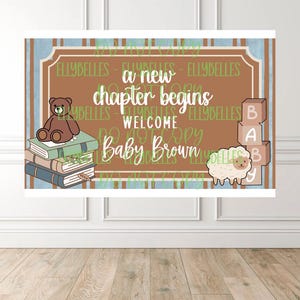 May include: A baby shower banner with a brown background and the text "a new chapter begins WELCOME Baby Brown." The banner features a teddy bear, books, a sheep, and blocks that spell "BABY."