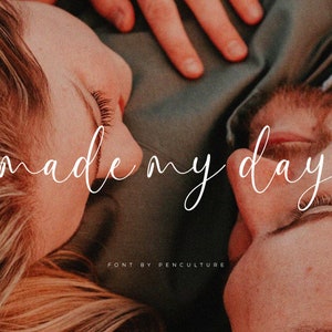 May include: A couple lying close together with the text "made my day" written in a white cursive font.