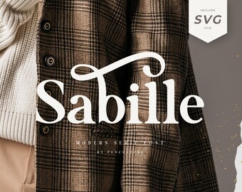 May include: A white font design with the word "Sabille" in a modern serif style. The text is displayed on a brown and black plaid fabric background.