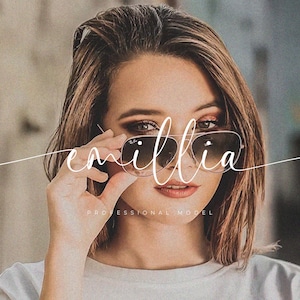 May include: A woman with brown hair wearing sunglasses and a white shirt. The text "emillia professional model" is written in white cursive script across the image.