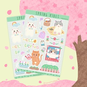 May include: A set of colourful spring-themed stickers featuring cats, flowers, butterflies, and the text "Hello Spring".