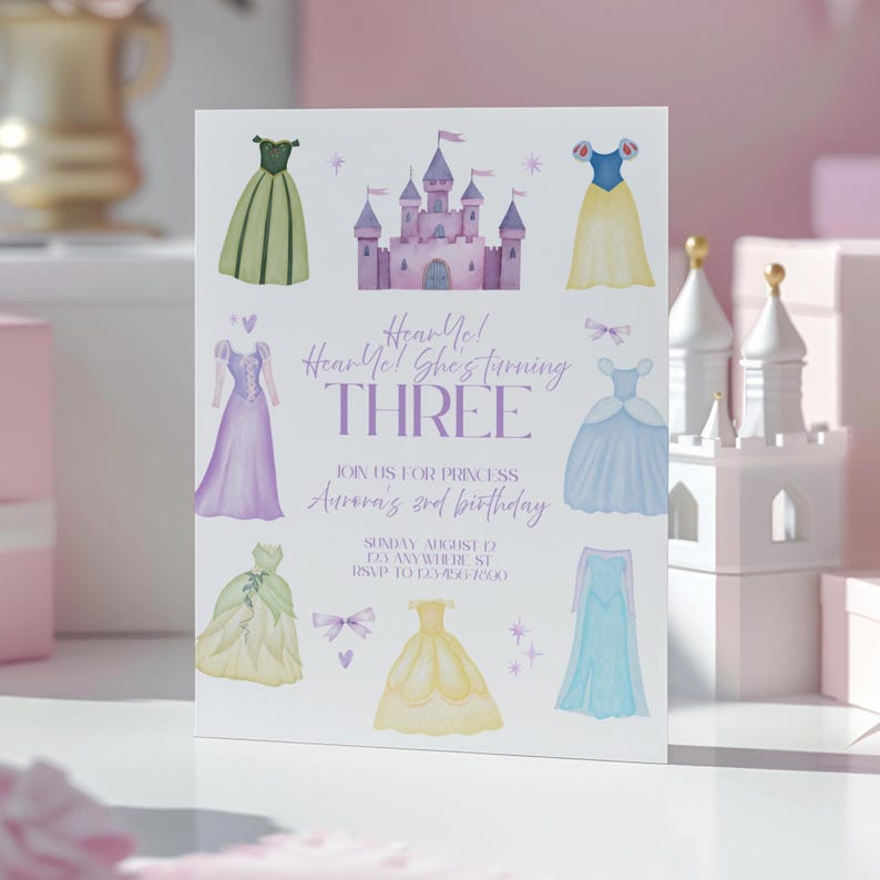 May include: A white invitation card with watercolor illustrations of princess dresses and a castle. The text reads "Hear Me! She's turning THREE" and invites guests to a princess's 3rd birthday party. The invitation includes the date, time, and RSVP information.