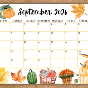 May include: A September 2026 calendar page featuring a grid with yellow lines. The design includes watercolor illustrations of orange and green pumpkins, autumn leaves, a basket of berries, and a potted plant. Two pencils are visible.