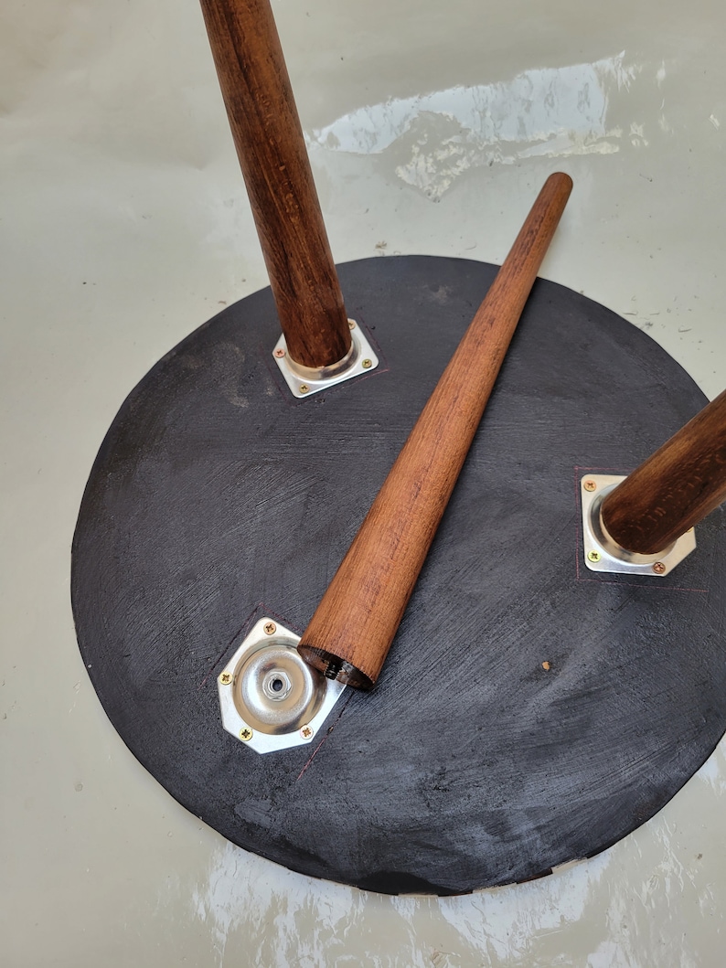 Underside detail of a handmade walnut table showing joinery