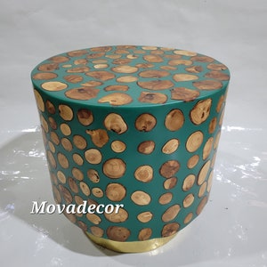 Round table made of olive wood and resin, elegant table in cool green color