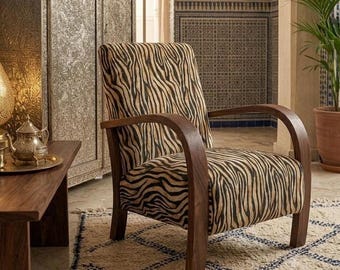 Mid-century modern walnut armchairs and handcrafted recliners with distinctive upholstery.
