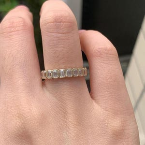 2.5 total carats of emerald diamonds between bars of icy platinum make this stunning ring a feast for the eyes and a gift to the soul.