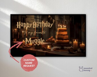 May include: A birthday-themed print featuring a layered cake with lit candles, surrounded by candles and pastries on a wooden table. The text reads "Happy Birthday to my favorite Muggle." A custom name request is available.