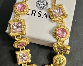 Opulent Opulence: Versace Gold Tone Choker with Pink and Lilac Medusa Head Gems