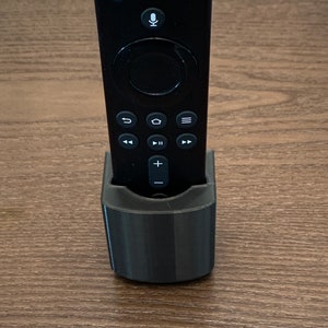 Fire stick TV Remote Control Holder For Wall, Bed, Side Of Couch, Coffee Table + Other! Attach By Adhesive!