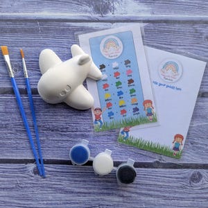 Plane plaster painting party favour bags. Plaster painting kit. Paint your own plasters.