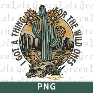 May include: A desert-themed graphic with a cactus, mountains, and a skull. The text reads "I GOT A THING FOR THE WILD ONES." The design features a color palette of teal, yellow, and brown, with a PNG label at the bottom.