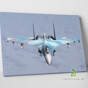 May include: A blue and gray fighter jet flies against a cloudy sky. The jet has a red star on the tail and is in mid-flight.