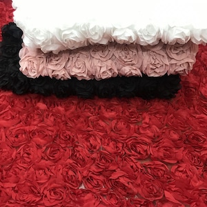 May include: Four layers of fabric with a 3D rose design. The top layer is white, the second layer is pink, the third layer is black, and the bottom layer is red.