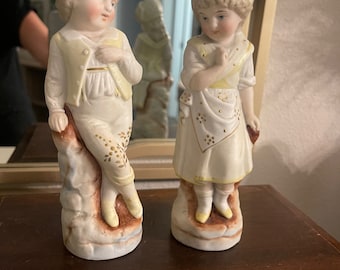 Pair of Vintage German Bisque Porcelain Boy and girl figures