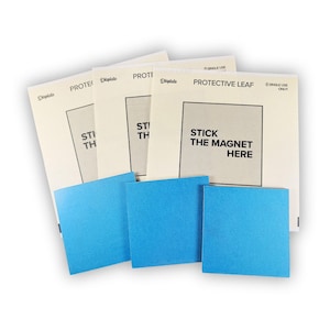 3 colgadores magnéticos Displate. Soportes de pared originales y nuevos para letreros y cuadros metálicos. Tres piezas autoadhesivas.