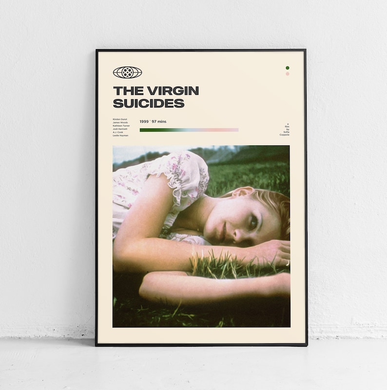 May include: A movie poster for the film "The Virgin Suicides" featuring a woman lying in a field of grass. The poster is in a black frame and has a cream background with black text. The text on the poster reads "The Virgin Suicides" and "1999 - 97 mins".