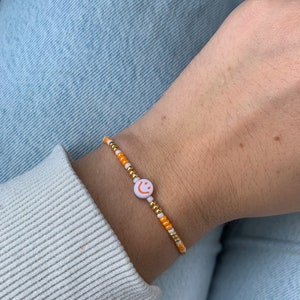 Smiley Perlenarmband Orange