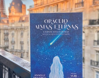 May include: A blue and white oracle deck called "Oraculo Almas Eternas" or "Eternal Souls Oracle" with 36 cards in Spanish and English. The deck features a starry night sky with a shooting star and a figure in a white robe.