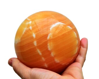 Orange kalcitkula – naturlig kristallkula, ursprung i Pakistan (65 mm-100 mm)