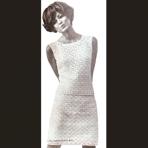 May include: A sleeveless white dress and skirt set with a geometric pattern. The outfit is made of a textured material and has a fitted silhouette. The image is a vintage photograph.