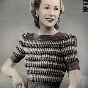 May include: A short-sleeved knit sweater featuring a repeating geometric pattern in shades of brown, black, and cream. The garment has a ribbed crew neckline, ribbed sleeve cuffs, and a wide ribbed waistband, creating a fitted silhouette.