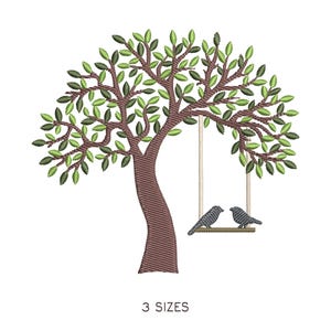 May include: An embroidered design of a tree with green leaves and a brown trunk. Two gray birds sit on a swing hanging from the tree. The text "3 SIZES" is below the tree.