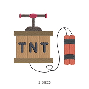 Può includere: Design ricamato di un bastoncino di dinamite TNT con un detonatore. La scatola di legno è marrone con le lettere TNT in blu navy. L'impugnatura del detonatore è marrone con una parte superiore rossa. La dinamite è rossa con bande nere. Il testo "3 MISURE" è in basso.